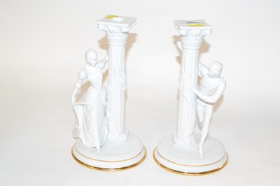 Lot 287 - A pair of white glazed porcelain candlesticks...