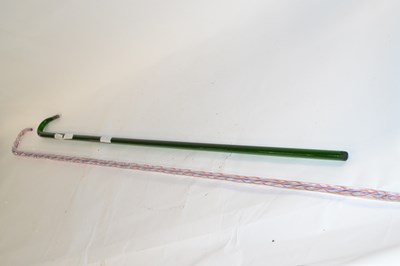 Lot 289A - Two glass walking sticks comprising a green...