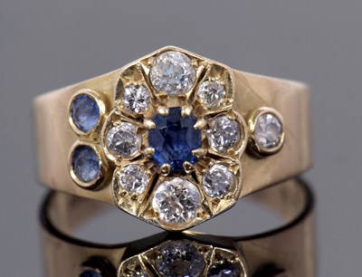 Lot 40 - A sapphire and diamond ring, set to centre...