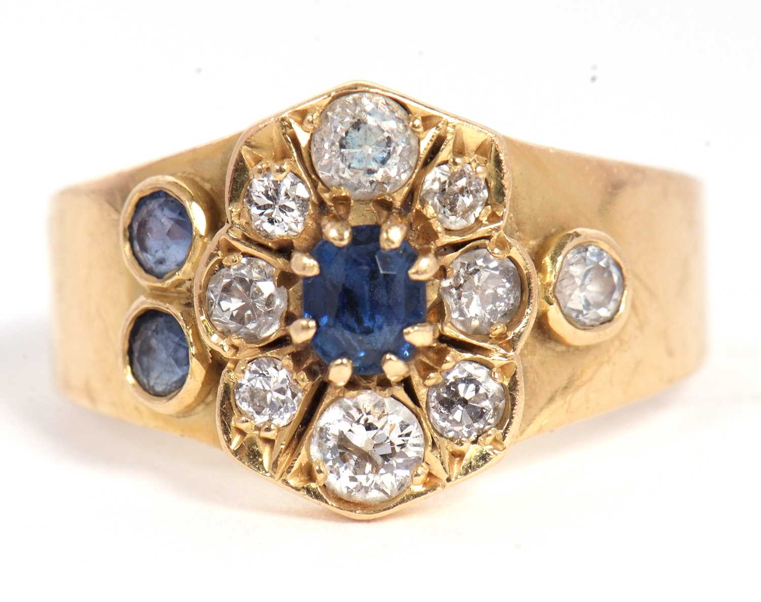 Lot 40 - A sapphire and diamond ring, set to centre...