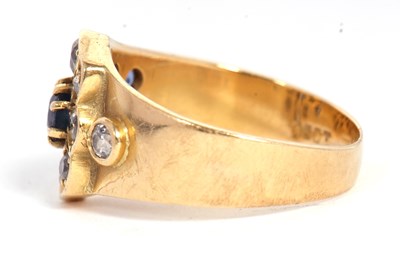 Lot 40 - A sapphire and diamond ring, set to centre...