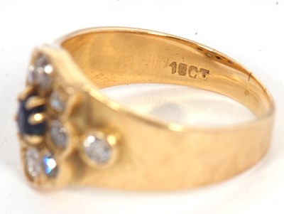 Lot 40 - A sapphire and diamond ring, set to centre...