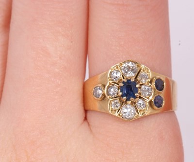 Lot 40 - A sapphire and diamond ring, set to centre...