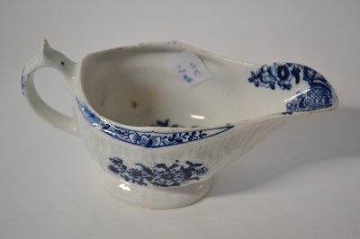 Lot 359 - A Lowestoft porcelain sauce boat, the fluted...