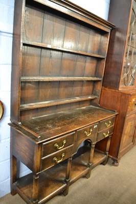 Lot 505 - A small Georgian style oak dresser with three...