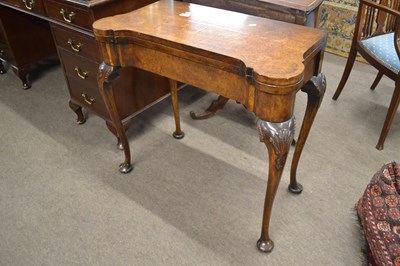 Lot 646 - A Georgian Revival burr walnut veneered card...