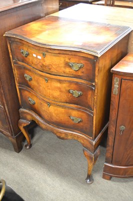 Lot 605 - A Georgian Revival walnut veneered serpentine...