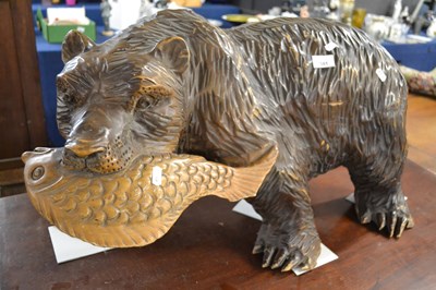 Lot 581 - A 20th Century carved wooden model of a bear...