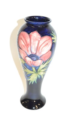 Lot 427 - Moorcroft - A tall baluster Anemone pattern...