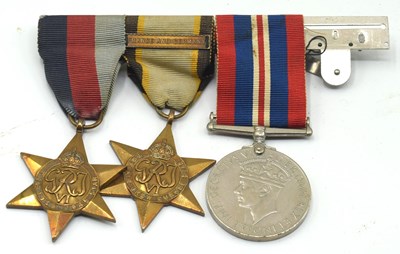 Lot 30 - Second World War unatributed medal trio to...