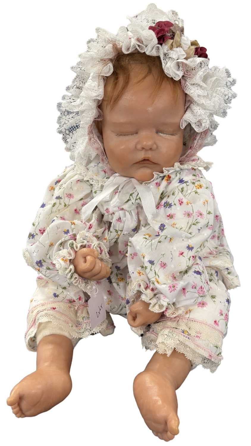 Lot 380 - A modern weighted baby reborn doll in white...