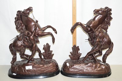 Lot 49 - A pair of hollow metal Marley horses with...