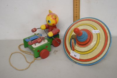 Lot 54 - A vintage spinning top and a push along cat toy