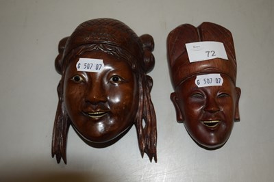 Lot 72 - A pair of small hardwood masks