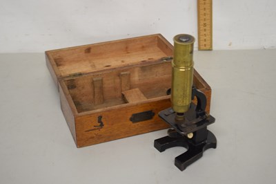 Lot 97 - A brass cased students microscope with wooden...