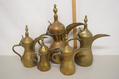 Lot 153 - A graduated group of five Middle Eastern brass...