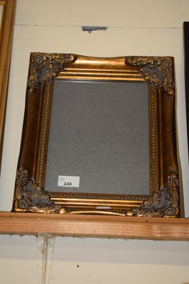 Lot 249 - A modern gilt finish picture frame with easel...