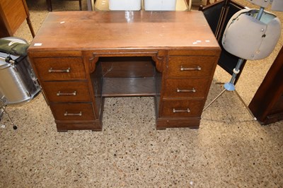 Lot 313 - An oak twin pedestal desk or dressing table in...