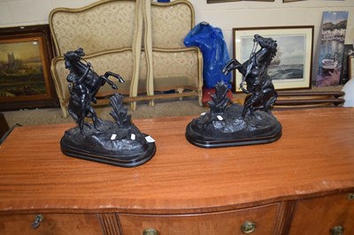 Lot 320 - A pair of black painted Marley horses