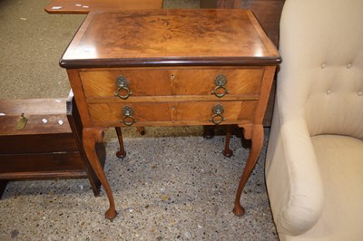 Lot 329 - A Georgian Revival walnut two drawer side...