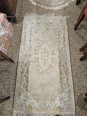 Lot 350 - Two Chinese washed wool floral decorated rugs,...