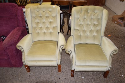 Lot 356 - A pair of wing back armchairs