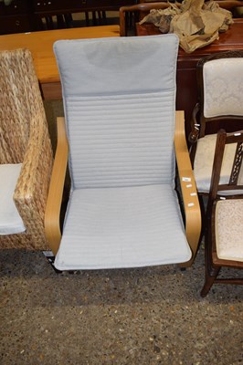 Lot 359 - A modern light wood framed armchair