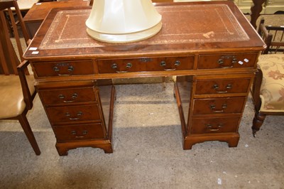 Lot 387 - A yew wood veneered twin pedestal office desk