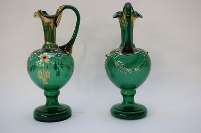 Lot 44 - Pair of 19th century green glass ewers with...