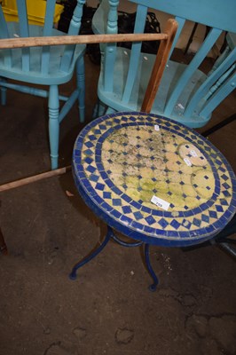 Lot 759 - A mosaic topped garden table