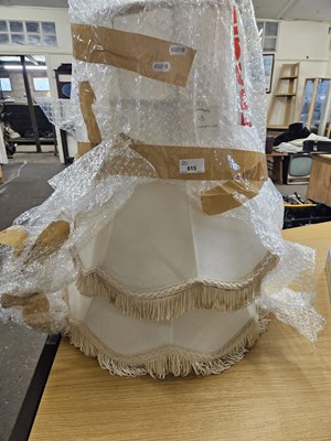 Lot 815 - A pair of cream fringed lampshades