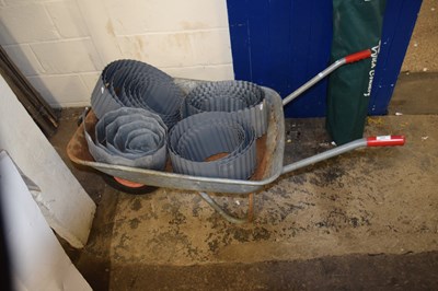 Lot 858 - A wheelbarrow and metal edging