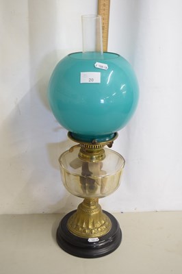 Lot 20 - An oil lamp with turquoise shade and clear...