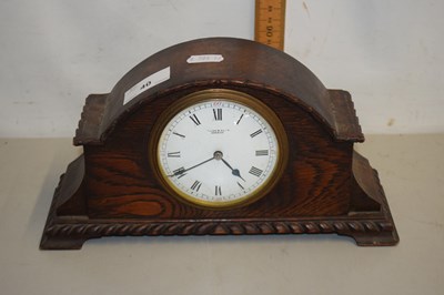 Lot 40 - An early 20th Century oak cased mantel clock...