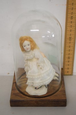 Lot 55 - A small porcelain doll and lamb