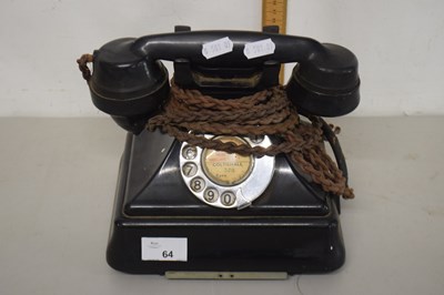 Lot 64 - A vintage black bakelite telephone