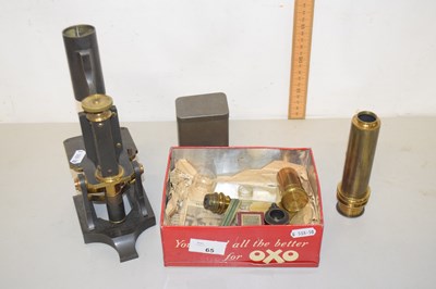 Lot 65 - A vintage brass and steel microscope, signed...