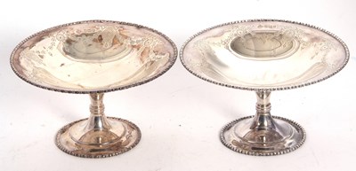 Lot 22 - A pair of small Edwardian silver pedestal...