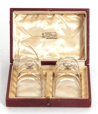 Lot 47 - A small pair of cased George V silver toast...