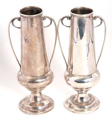 Lot 2 - A pair of Art Nouveau silver twin handled...