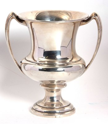 Lot 6 - A sterling stamped solid two handled...