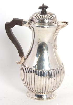 Lot 11 - A Victorian Scottish silver hot water jug of...