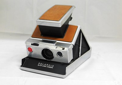 Lot 86 - A Polaroid SX-70 Land Camera, with brown body