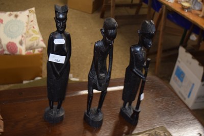 Lot 78 - A set of three African hardwood figures,...