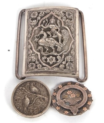 Lot 180 - A white Middle Eastern buckle embossed with...