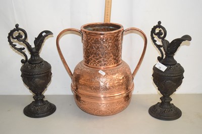 Lot 12 - A Middle Eastern copper double handled vase...