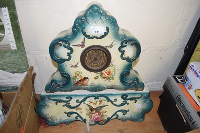 Lot 641 - EARLY 20TH CENTURY CERAMIC CASED CLOCK AND STAND