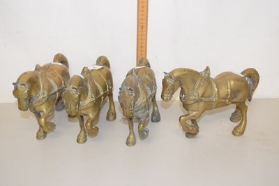 Lot 81 - Group of four brass model cart horses