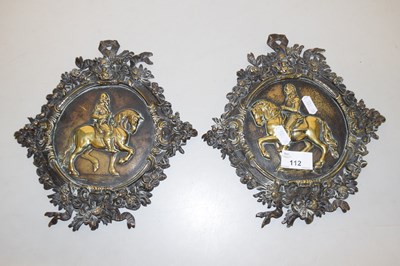 Lot 112 - A pair of polished brass wall plaques in...