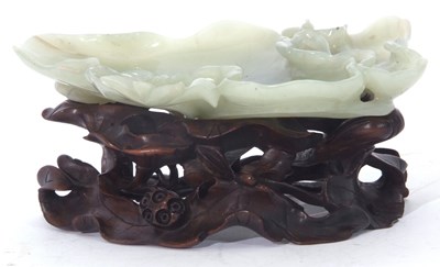 Lot 124 - Green jade dish on carved wooden stand, 15cm long
